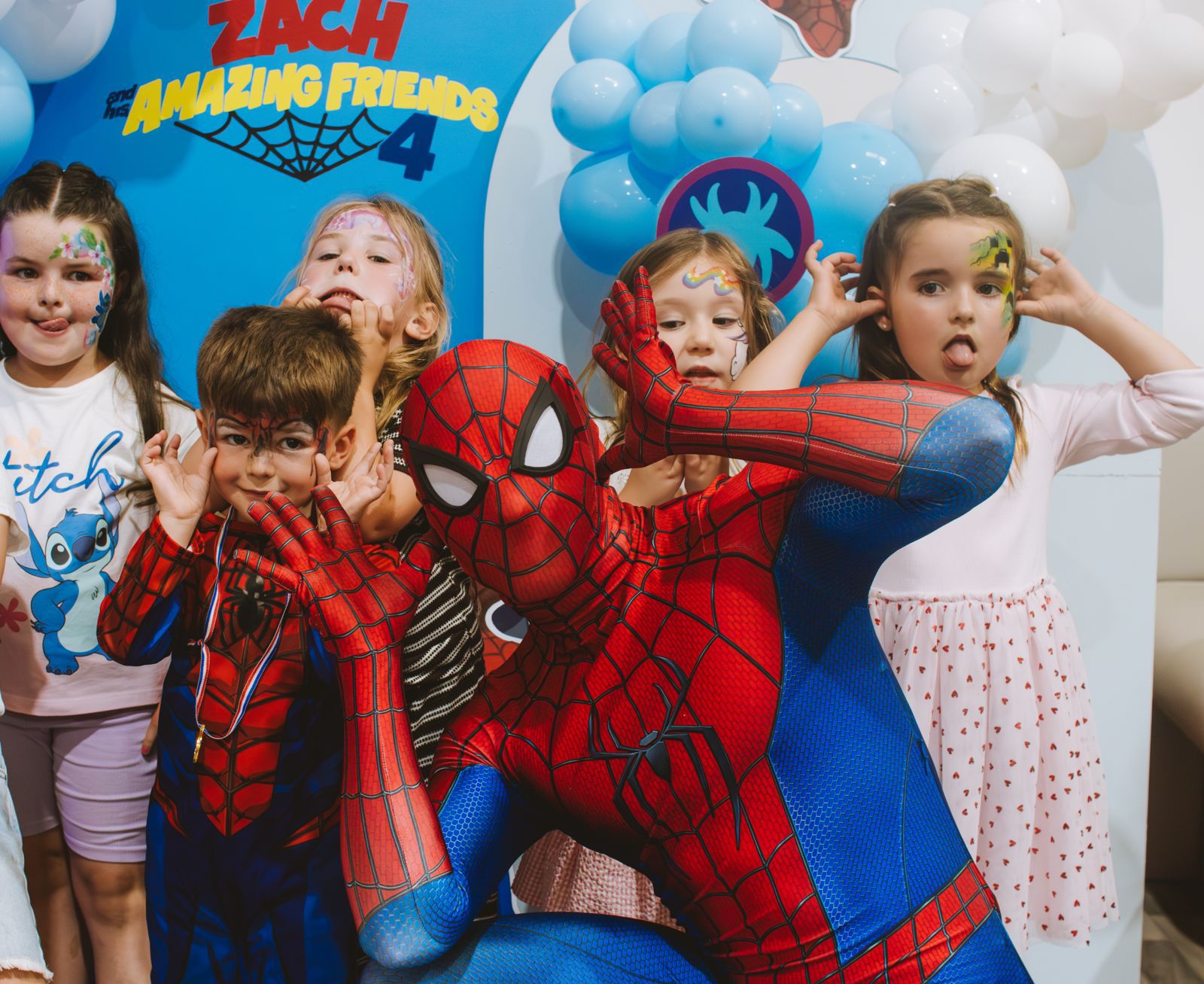Children with Spider-Man at a Giggle Street superhero themed birthday party